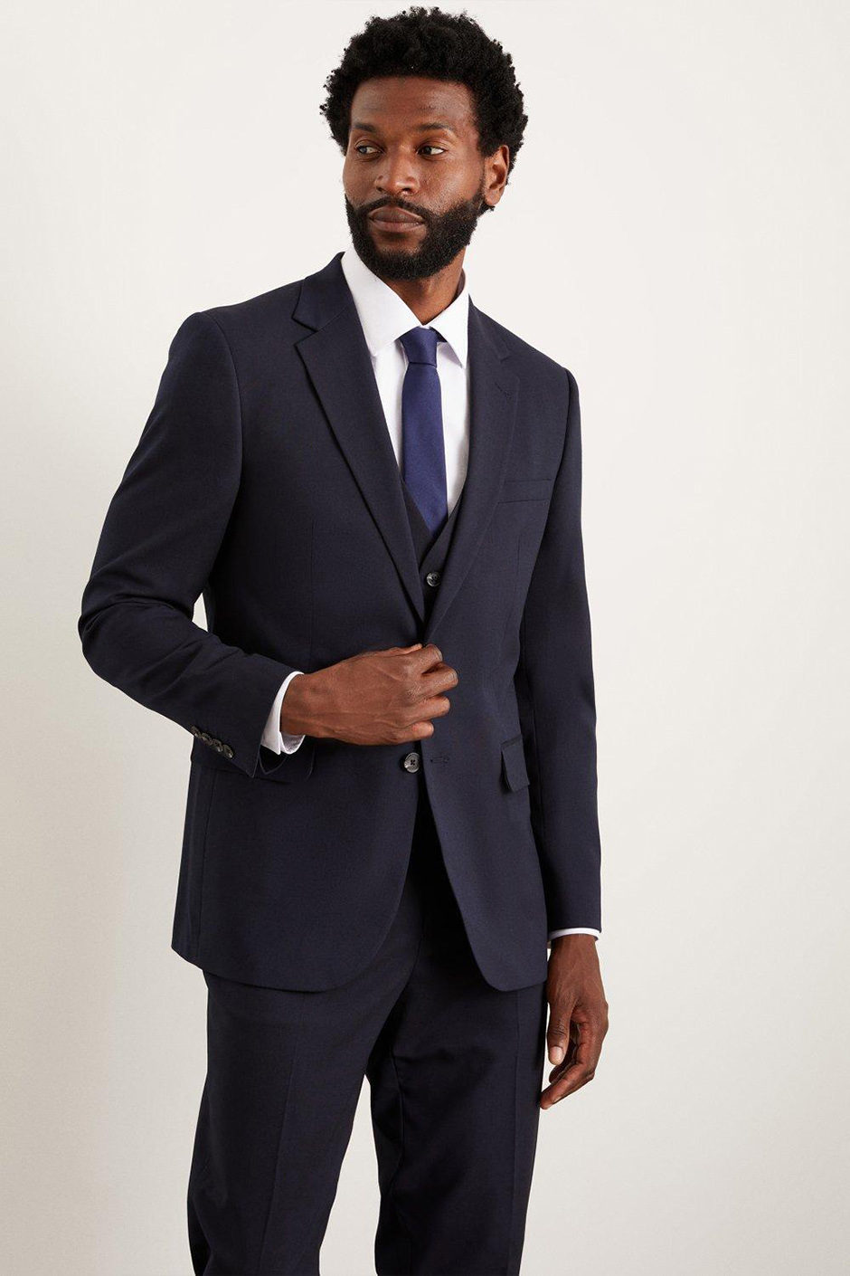 Navy groomsmen suit from Burton in a tailored style slim fit for weddings 