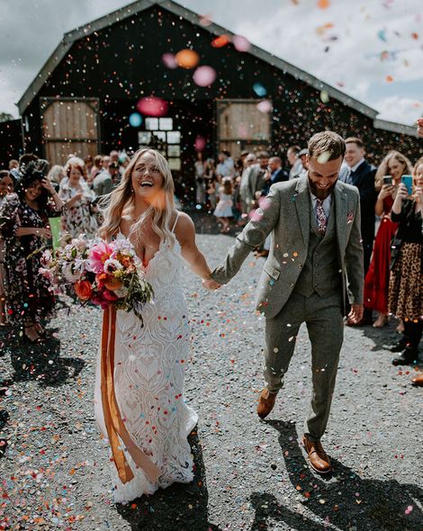 colourful confetti exit for bride and groom at the giraffe shed rock my wedding mark horton photos