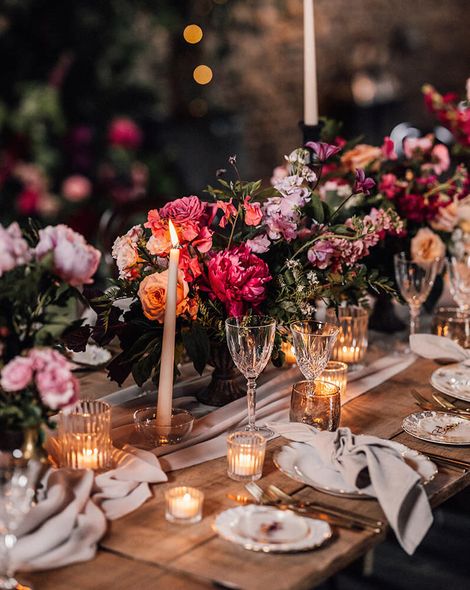 romantic pink floral arrangements and white candles wedding tablescape rock my wedding sam docker