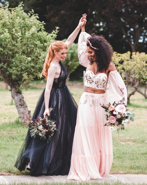 Autism marriage inclusive wedding inspiration with two brides in a black wedding dress and pink embroidered bridal separates