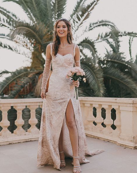 Carmen de los Mártires Spanish destination wedding with bespoke gold sparkly bridal gown with front slit
