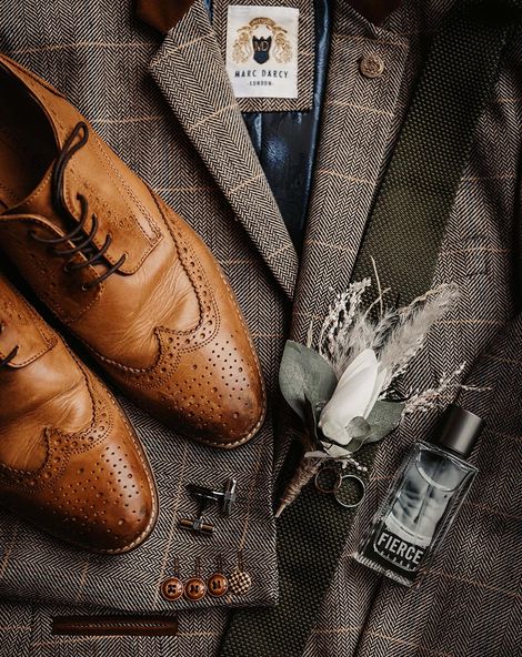Groom accessories with the suit jacket, groom shoes, groom cologne and more.