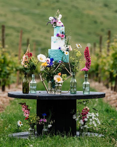 Colourful wedding inspiration at Little Wold Vineyard with wild flowers, buttercream cake and lace dresses 