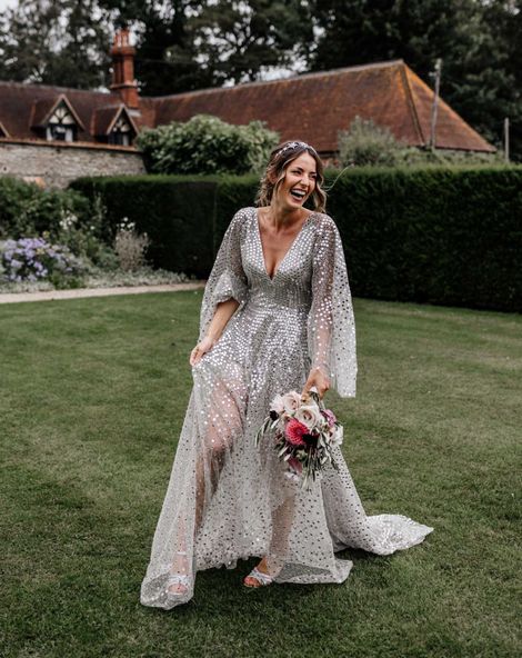 Silver sequin wedding dress, and gypsophila flower clouds for a marquee reception at home 