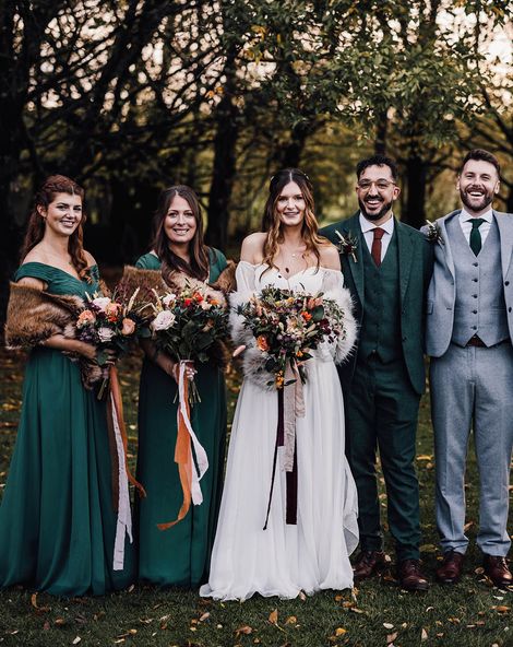 Forest green autumnal bridesmaid dresses for November wedding at Cripps Barn.