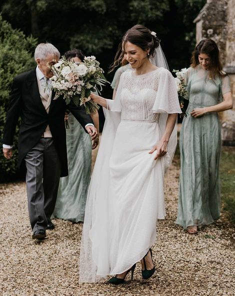 Classic Kelmarsh Hall wedding with green bridesmaid dresses, morning suits and joint speeches.