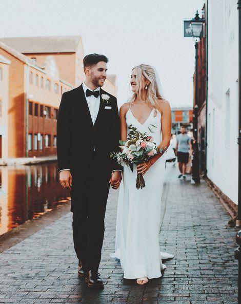 Intimate Gas Street church wedding with the bride in a slip wedding dress and the groom in a tuxedo 