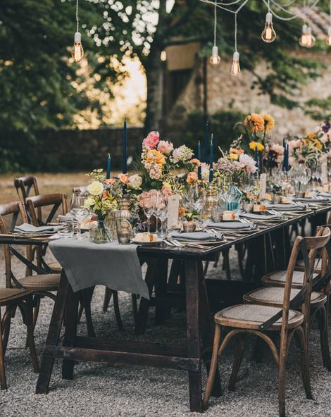 Wedding Table Decorations with candles, table runners, flowers and cutlery