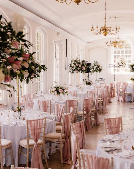Goldney Hall wedding venue with pink chairbacks and decor.