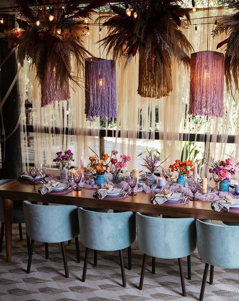Brazil destination wedding at villa mandacaru with purple theme tablescape and statement hanging lights