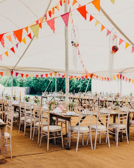 Colourful Bunting Wedding Decor for a Festival Themed Marquee Wedding with Fox Wedding Gown by Rue de Seine, shot by Peppermint Love Photography