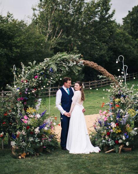 Moon Gate Arch With Bright Flowers For Garden Marquee Wedding