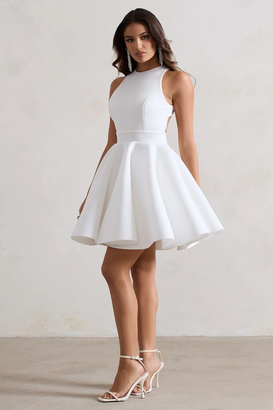 White mini dress with racer neckline and backless design from Club L London