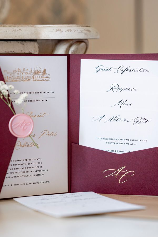 Burgundy Pocketfold with custom venue sketch in gold foil press, custom foilpress initial and names, with bespoke wax seal