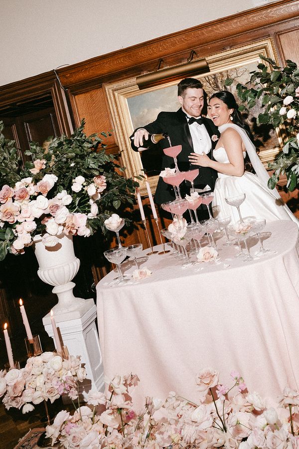 luxury wedding at dundas castle scotland pink florals champagne tower by Connor Barrett Photography