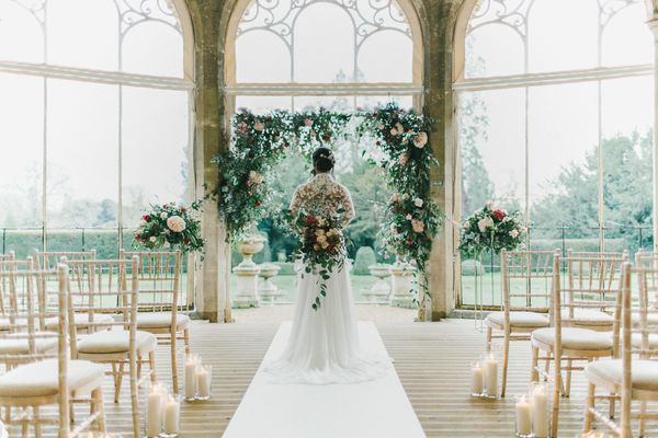 Blush & Burgundy Floral Fairytale Wedding at Grittleton House Planned & Styled by Jennifer Louise Weddings with Floral Arch. Katherine Yiannaki Photography
