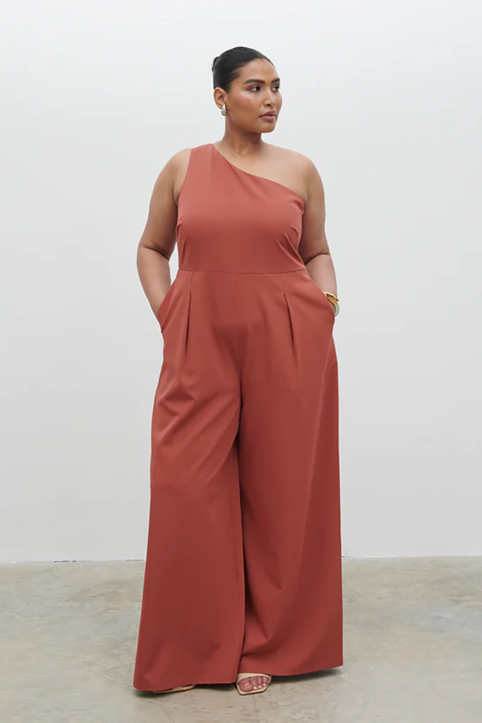 plus size and autumn wedding guest jumpsuit from Pretty Lavish with one shoulder and wide legs