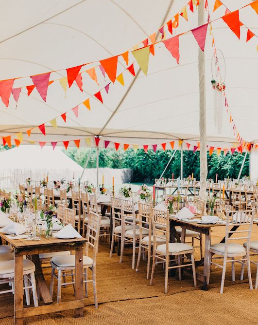 Colourful Bunting Wedding Decor for a Festival Themed Marquee Wedding with Fox Wedding Gown by Rue de Seine, shot by Peppermint Love Photography