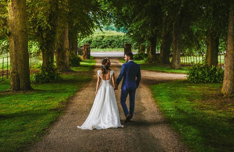 david lefebvre photography moody evening country lane photo of golden hour sunlight on bride and groom at plum park hotel in towcester with wedding photographer david lefebvre on rock my wedding