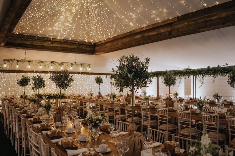 the normans grain shed dining area and rustic tables. photo by bloomweddings.co.uk