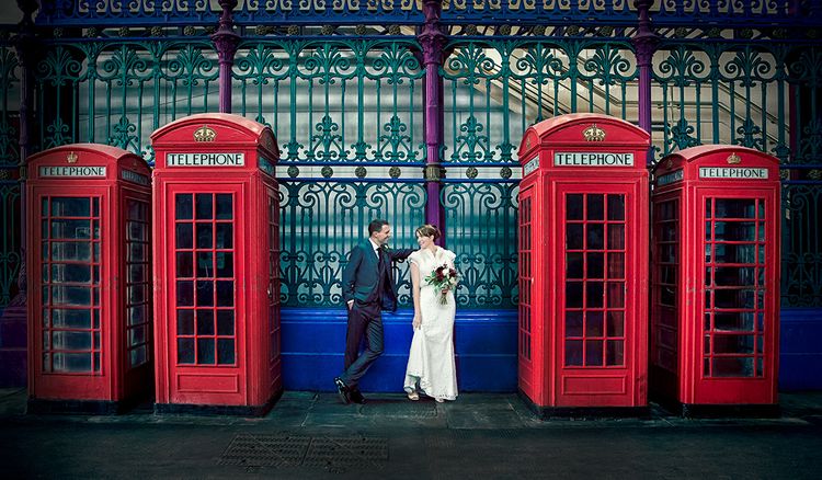 big day weddings couple by red phone boxes london wedding day