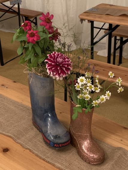 great betley farmhouse wellies planted up for wedding decorations 1000px
