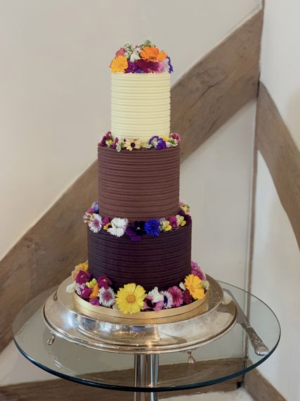 cocoa whey cakes 3 tiers of ganache with edible flowers