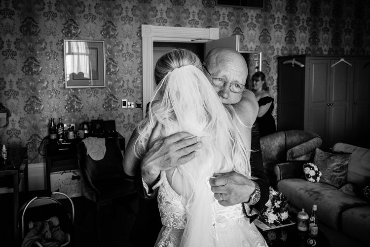james soules photography dad hugs bride at wedding in kent dover