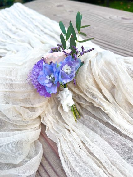 amy carlile flowers pastels   buttonhole with delphinium as focus