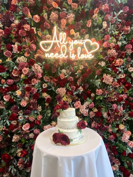 bliss events by katie rebecca flower wall  all you need is love neon sign
