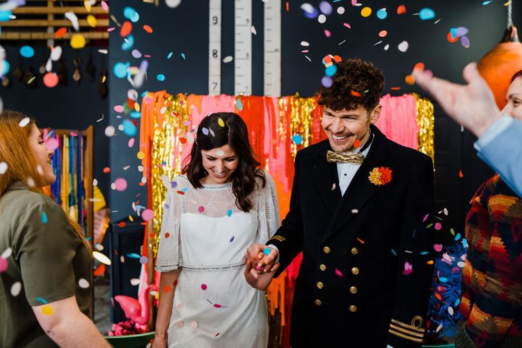 Confetti moment at boat shed wedding with colourful wedding theme