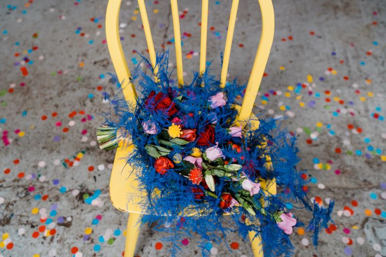 Blue and red wedding bouquet for colourful wedding theme