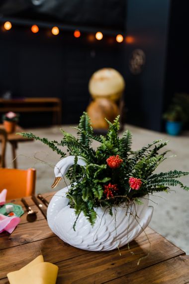 Plant in swan ceramic vase