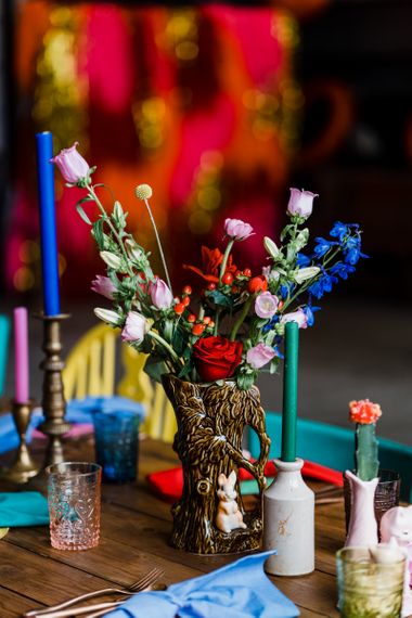 Flower stems in ornate vase for colourful wedding theme