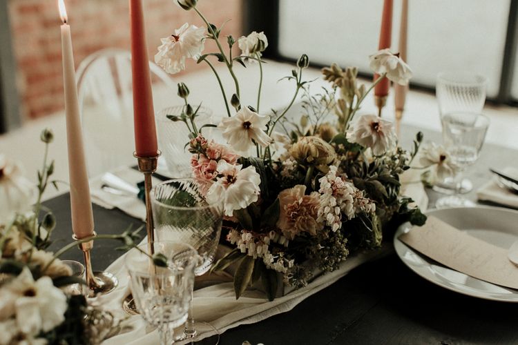 Delicate pink, white and green wedding flower centrepiece