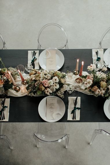 Romantic reception tablescape with flower and candle centrepiece decor