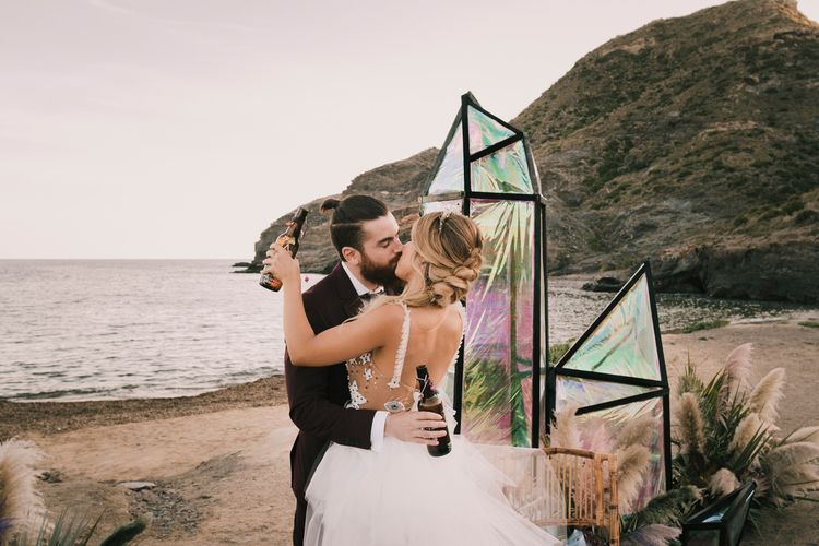 Bride and groom embrace