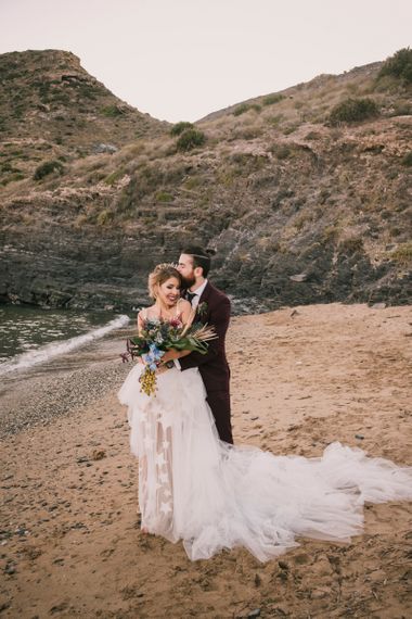 Bride and groom on Spanish beach