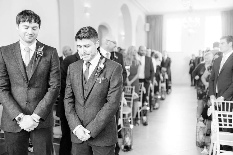 Groom at the Aisle in Slater Suit | Red New Years Eve Winter Wedding at Iscoyd Park, Shropshire | White Stag Wedding Photography | Lovetwofilm