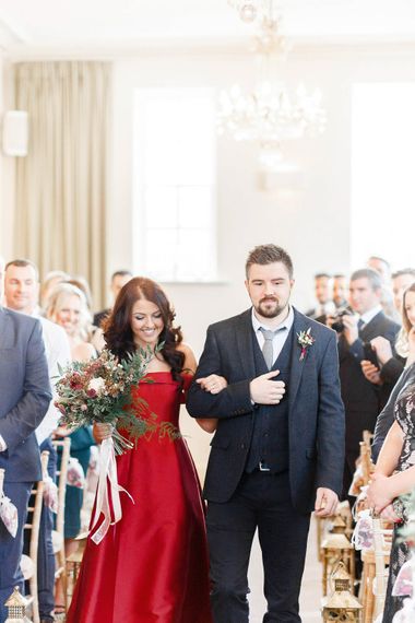 Wedding Ceremony | Bridal Entrance in Bespoke Red Gown from Agape Bridal Boutique | Red New Years Eve Winter Wedding at Iscoyd Park, Shropshire | White Stag Wedding Photography | Lovetwofilm