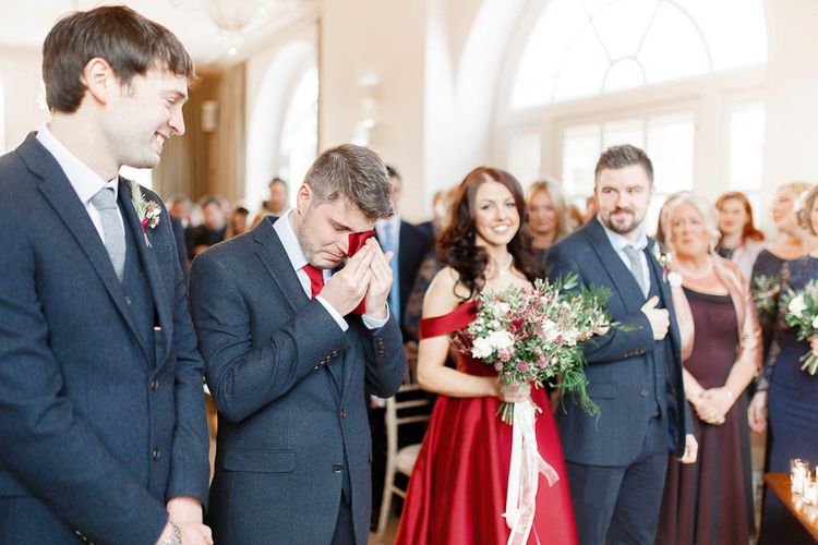 Wedding Ceremony | Bride in Bespoke Red Gown from agape Bridal Boutique | Groom in Slaters Suit | Red New Years Eve Winter Wedding at Iscoyd Park, Shropshire | White Stag Wedding Photography | Lovetwofilm