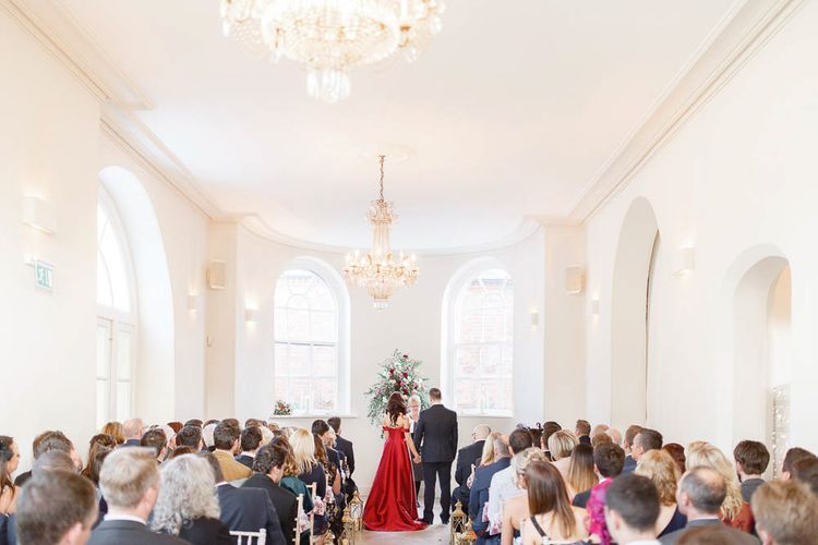 Wedding Ceremony | Bride in Bespoke Red Gown from agape Bridal Boutique | Groom in Slaters Suit | Red New Years Eve Winter Wedding at Iscoyd Park, Shropshire | White Stag Wedding Photography | Lovetwofilm