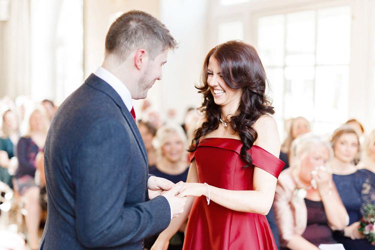 Wedding Ceremony | Bride in Bespoke Red Gown from agape Bridal Boutique | Groom in Slaters Suit | Red New Years Eve Winter Wedding at Iscoyd Park, Shropshire | White Stag Wedding Photography | Lovetwofilm