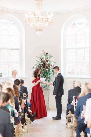 Wedding Ceremony | Bride in Bespoke Red Gown from agape Bridal Boutique | Groom in Slaters Suit | Red New Years Eve Winter Wedding at Iscoyd Park, Shropshire | White Stag Wedding Photography | Lovetwofilm