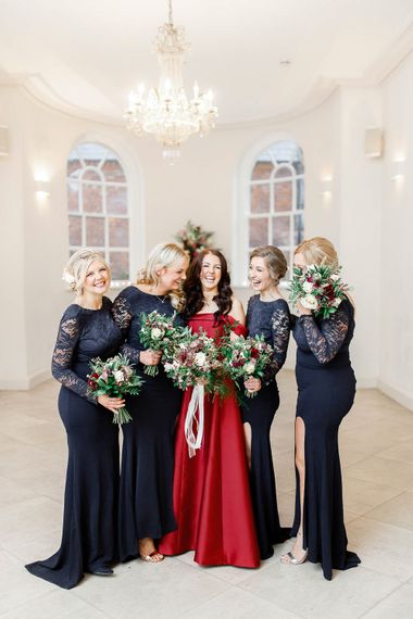 Bridal Party | Bridesmaids in Lace Navy Dresses | Bride in Bespoke Red Gown from agape Bridal Boutique | Red New Years Eve Winter Wedding at Iscoyd Park, Shropshire | White Stag Wedding Photography | Lovetwofilm