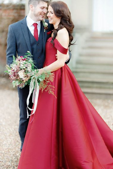 Bride in Bespoke Red Gown from agape Bridal Boutique | Groom in Slaters Suit | Red New Years Eve Winter Wedding at Iscoyd Park, Shropshire | White Stag Wedding Photography | Lovetwofilm