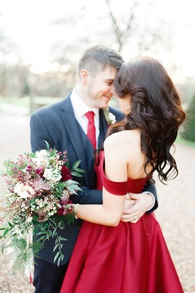 Bride in Bespoke Red Gown from agape Bridal Boutique | Groom in Slaters Suit | Red New Years Eve Winter Wedding at Iscoyd Park, Shropshire | White Stag Wedding Photography | Lovetwofilm