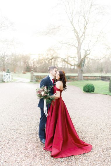 Bride in Bespoke Red Gown from agape Bridal Boutique | Groom in Slaters Suit | Red New Years Eve Winter Wedding at Iscoyd Park, Shropshire | White Stag Wedding Photography | Lovetwofilm