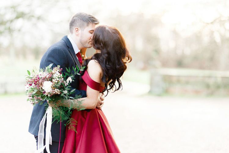 Bride in Bespoke Red Gown from agape Bridal Boutique | Groom in Slaters Suit | Red New Years Eve Winter Wedding at Iscoyd Park, Shropshire | White Stag Wedding Photography | Lovetwofilm