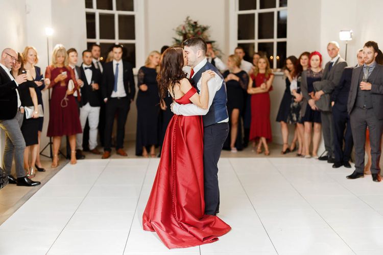 First Dance | Bride in Bespoke Red Gown from agape Bridal Boutique | Groom in Slaters Suit | Red New Years Eve Winter Wedding at Iscoyd Park, Shropshire | White Stag Wedding Photography | Lovetwofilm
